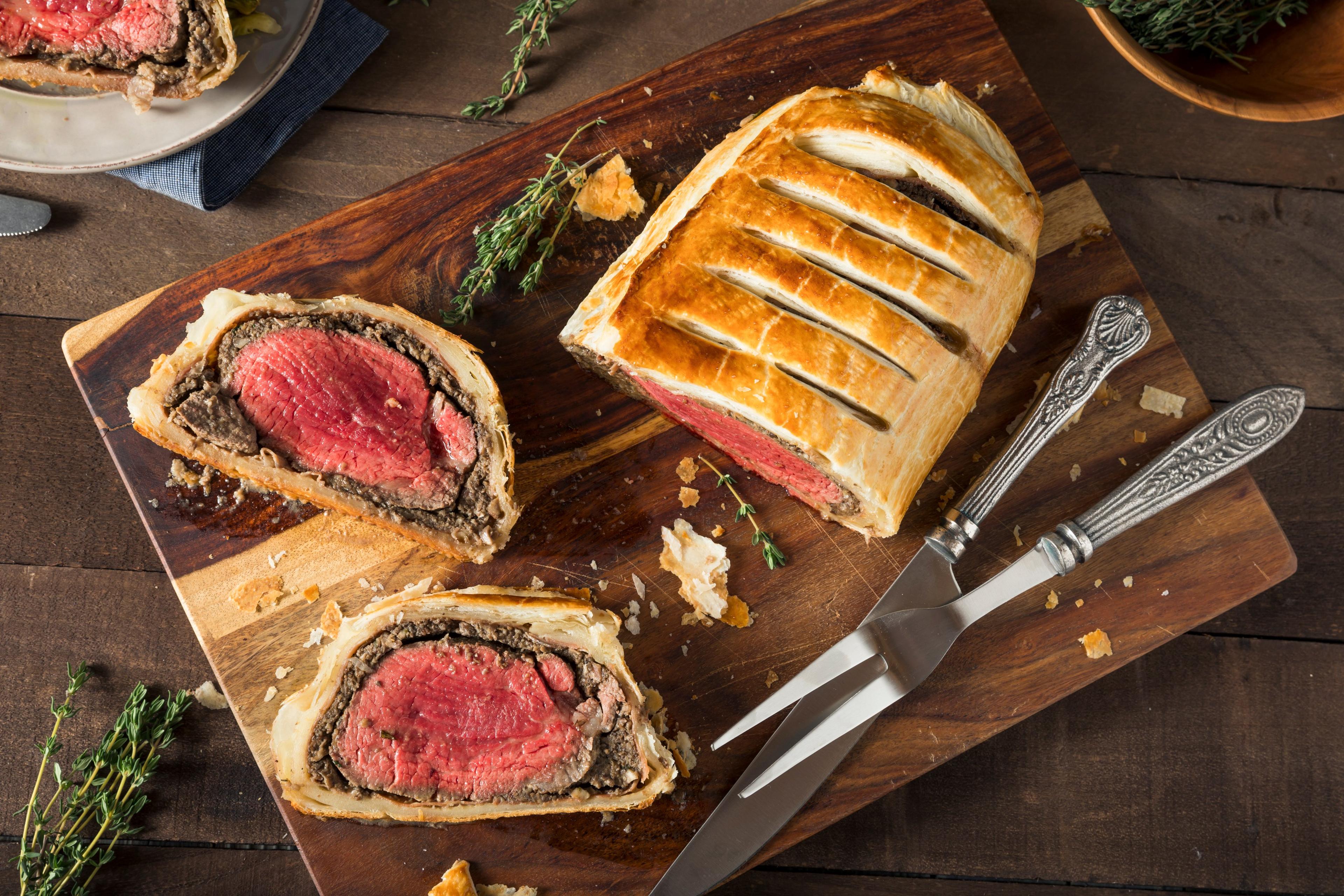 Image of beef wellington on a wooden cutting board